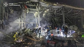 Rescue team works to extinguish a fire following a Russian attack in Kharkiv, Ukraine, photo provided by the Ukrainian Emergency Service, Tuesday, Jan. 13, 2026.