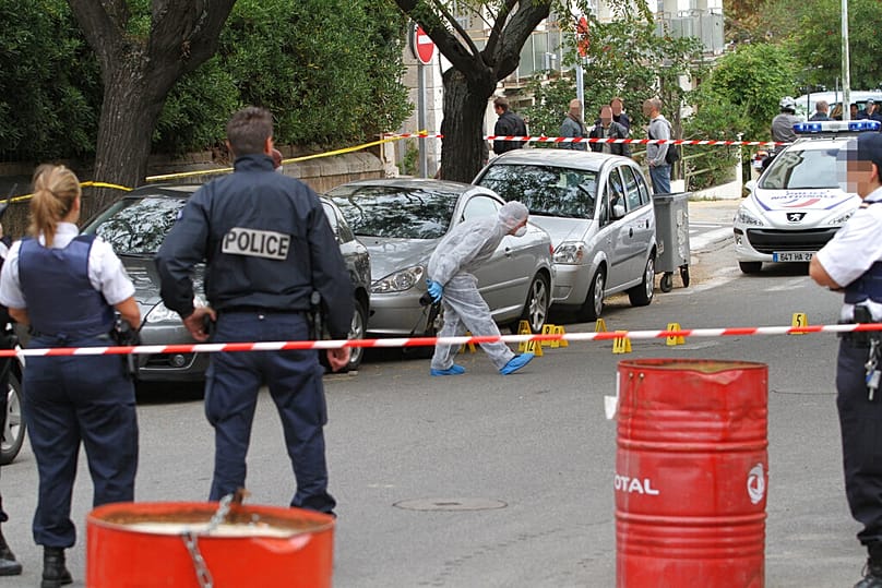 FILE: Police officers looking for clues after Corsican nationalist Antoine Nivaggioni was assassinated in Ajaccio, Corsica, 18 October 2010
