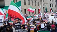 Protesters participate in a demonstration supporting protesters in Iran, in front of the US Consulate, Milan, Italy, Tuesday, Jan. 13, 2026. (AP Photo/Luca Bruno)