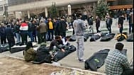 An image from footage circulating on social media shows a morgue with dozens of bodies and mourners after a security crackdown on protesters on the outskirts of Tehran.