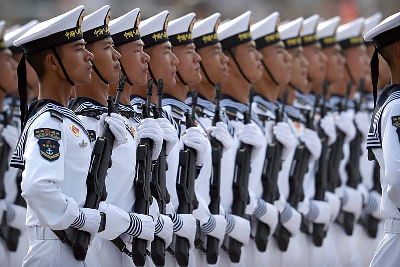 Soldiers from China's People's Liberation Army (PLA) Navy march in formation during a parade in Beijing, 1 October, 2019