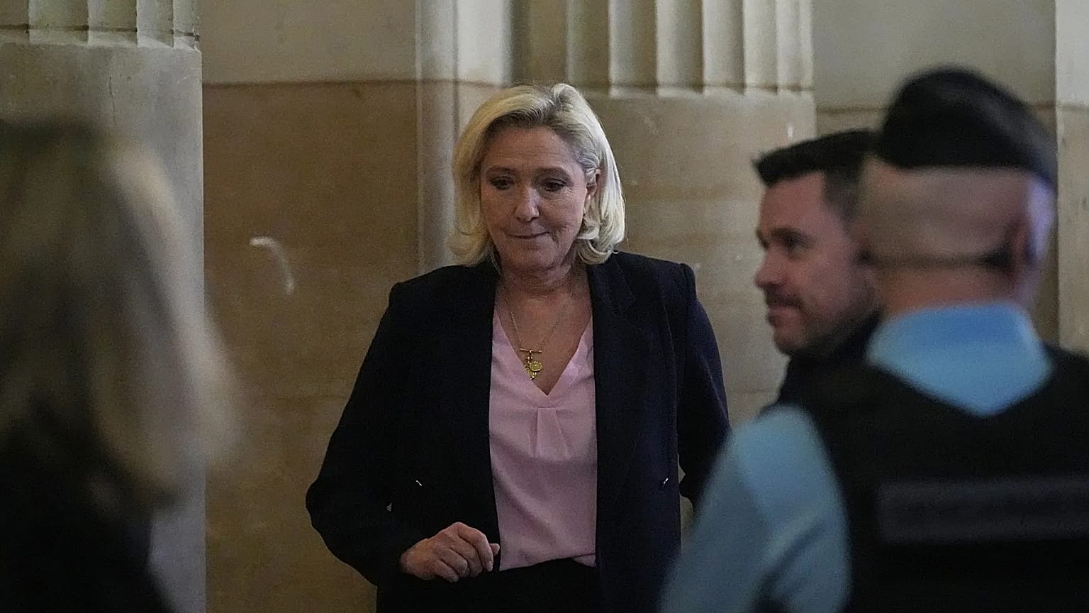 Far-right leader Marine Le Pen returns after a break during her appeal trial after an embezzlement conviction in Paris, 13 January, 2026 