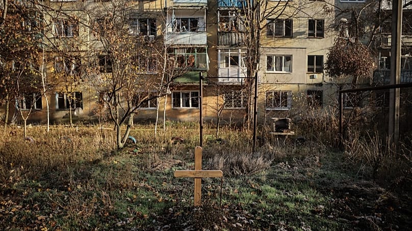 FILE: In this photo, taken on Nov. 15, 2025, a grave of a civilian is seen in the yard of damaged residential houses in the frontline town of Kostyantynivka, Ukraine.