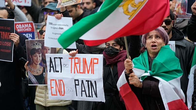 Protesters participate in a demonstration supporting protesters in Iran, in front of the US Consulate, Milan, Italy, Tuesday, Jan. 13, 2026.