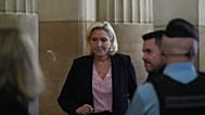 Marine Le Pen fait son retour après une pause lors de son procès en appel suite à une condamnation pour détournement de fonds, mardi 13 janvier 2026 à Paris.