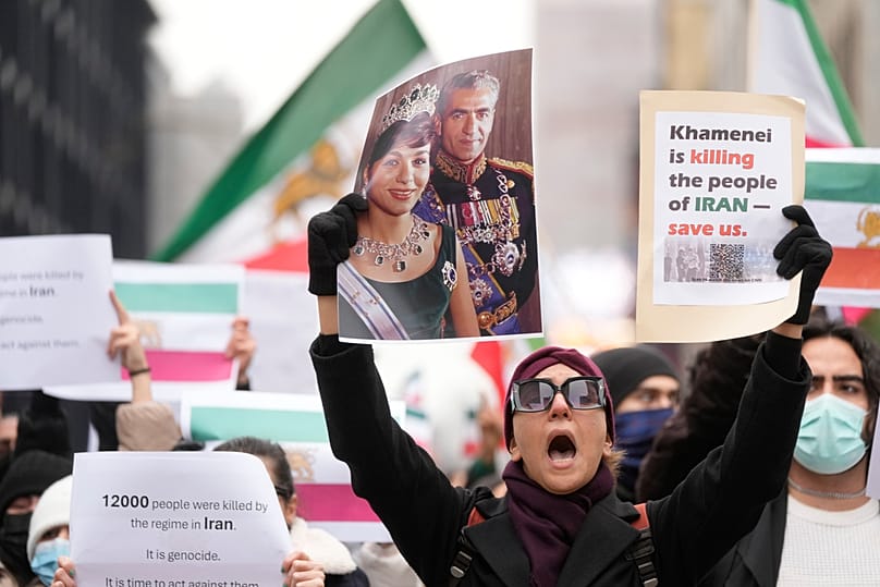 Protesters participate in a demonstration supporting protesters in Iran, in front of the US Consulate, Milan, Italy, Tuesday, Jan. 13, 2026. (AP Photo/Luca Bruno)