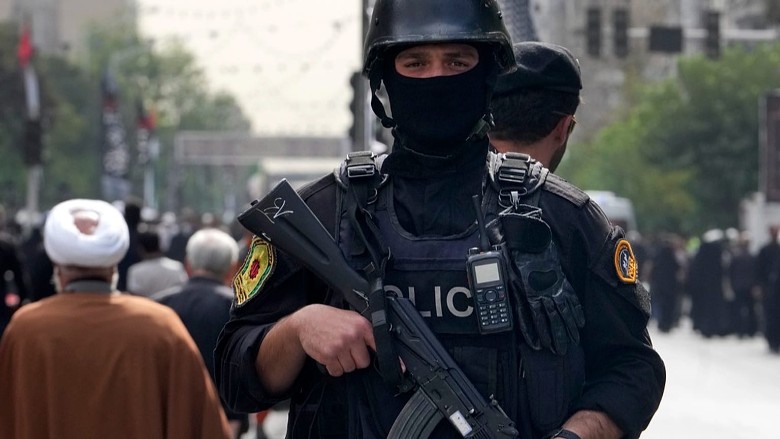 FILE: An Iranian police officer stands guard during the funeral ceremony of Hamas leader Ismail Haniyeh and his bodyguard, in Tehran, 1 August 2024