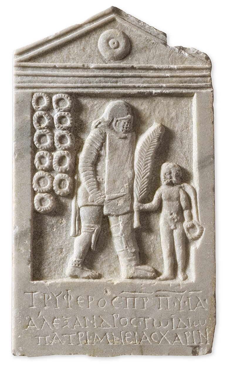 Μαρμάρινη επιτύμβια στήλη του μονομάχου Τρύφερου, την οποία προσέφερε στη μνήμη του ο γιος του Αλέξανδρος. Πάτρα, Βόρειο νεκροταφείο, 2ος-3ος αι. μ.Χ.