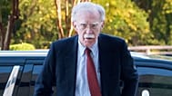 Former Trump administration national security adviser John Bolton, left, arrives for his arraignment at the federal courthouse in Greenbelt, Md., Friday, Oct. 17, 2025. 
