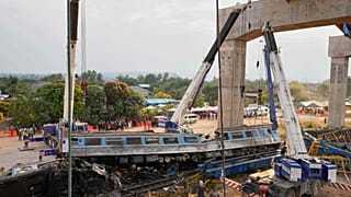 The scene after a construction crane fell into a passenger train in Nakhon Ratchasima province