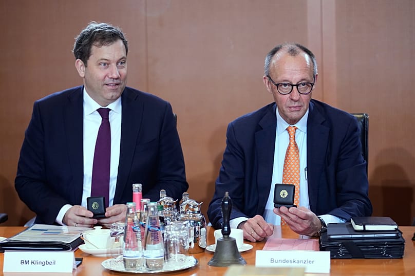 German Chancellor Friedrich Merz, right, and Vice Chancellor Lars Klingbeil attend a cabinet meeting at the chancellery in Berlin, 14 January, 2026