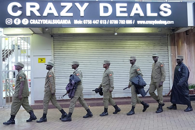 Uganda security forces patrol a street ahead of the general election in Kampala, Uganda, Wednesday, Jan. 14, 2026.