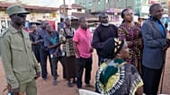 Voters wait to cast their ballots during the presidential election in Kampala