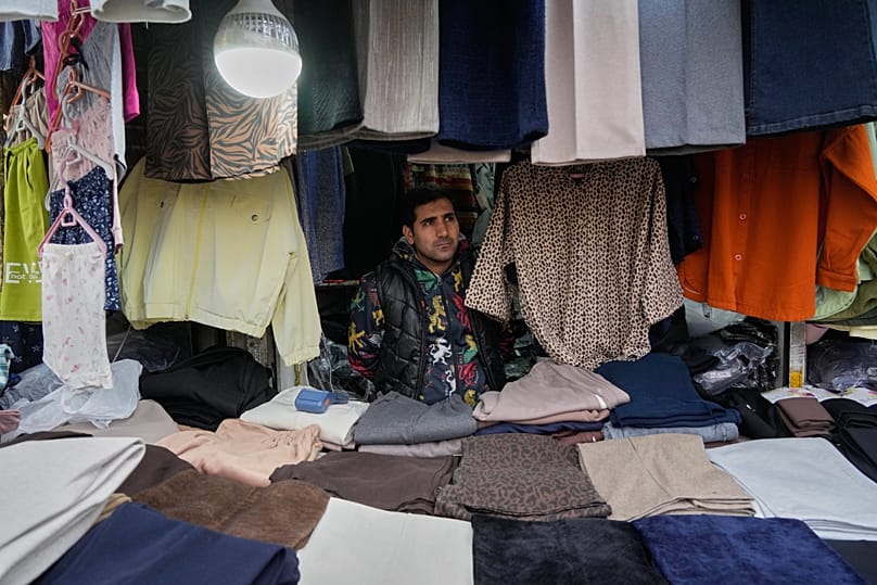 A shopkeeper waits for customer at Tehran's historic Grand Bazaar, 20 January, 2026