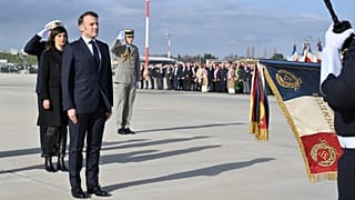 French President Emmanuel Macron salutes the troops during his visit to the Istres military air base