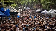 FILE - People crowd along the historic La Rambla promenade of Barcelona as Catalans celebrate the day of their patron Sant Jordi, Spain, Sunday, April 23, 2023. 