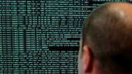 A solider watches code lines on his computer at the International Cybersecurity forum in Lille, 23 January, 2018