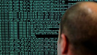 A solider watches code lines on his computer at the International Cybersecurity forum in Lille, 23 January, 2018