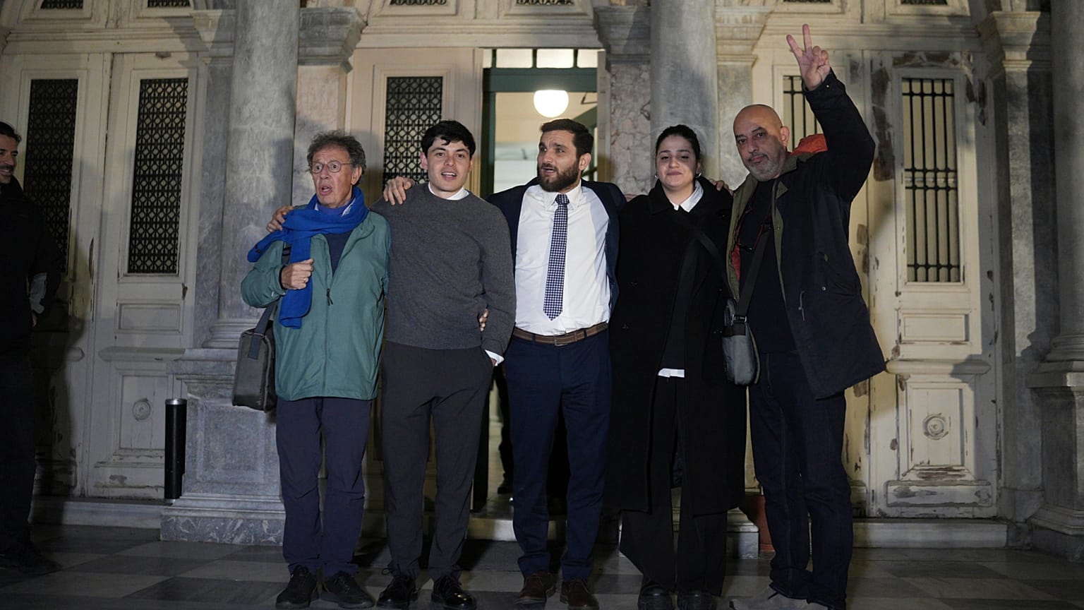 Rescue volunteers and their lawyer celebrate outside a courthouse in Mytilene, on the northeastern Aegean island of Lesbos, Greece, 15 January 2026.