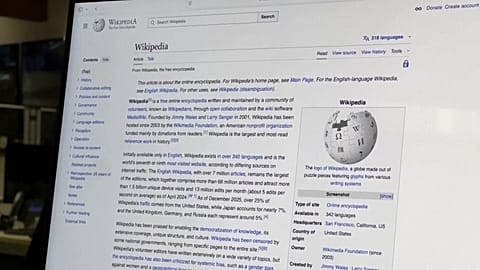 Wikipedia’s founder says AI companies relying on the site’s content should contribute more to its upkeep.