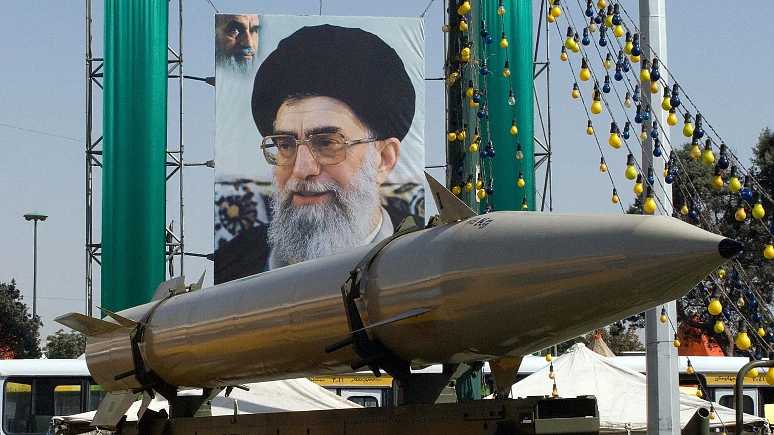 A missile seen backdropped by a poster of Ayatollah Ali Khamenei in Tehran, 23 September, 2008