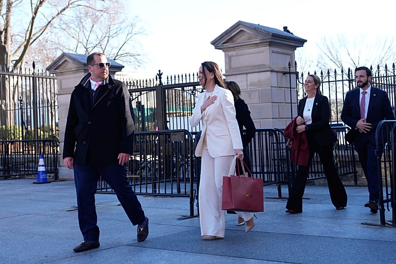 Venezuelan opposition leader María Corina Machado gestures to supporters on Pennsylvania Avenue as she leaves the White House after meeting with Donald Trump Thursday.