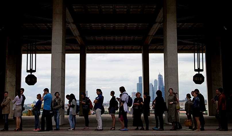 FILE: People queue to attend a lecture by US Nobel laureate biologist James Watson, at the Russian Academy of Sciences, Moscow, 17 June 2015