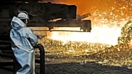 A steel worker watches the hot metal at the Thyssenkrupp steel factory in Duisburg, Germany, Friday, April 27, 2018. Duisburg is the biggest steel producer site in Europe. 