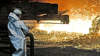 A steel worker watches the hot metal at the Thyssenkrupp steel factory in Duisburg, Germany, Friday, April 27, 2018. Duisburg is the biggest steel producer site in Europe. 