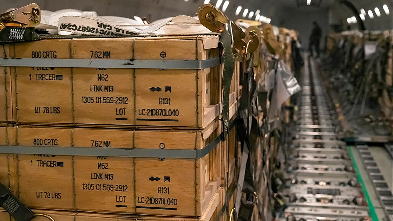 FILE: Pallets of ammunition, weapons and other equipment bound for Ukraine are loaded on a plane  at Dover Air Force Base, 30 January 2022