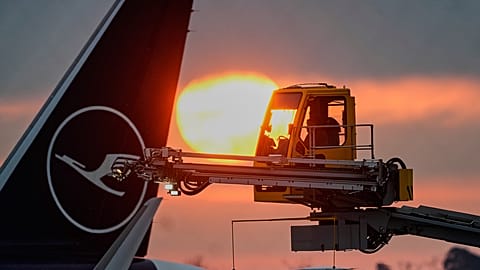FILE: The sun rises as a Lufthansa's aircraft is de-iced at the airport in Frankfurt, as temperatures dropped to -6 degrees Celsius, 5 January 2026