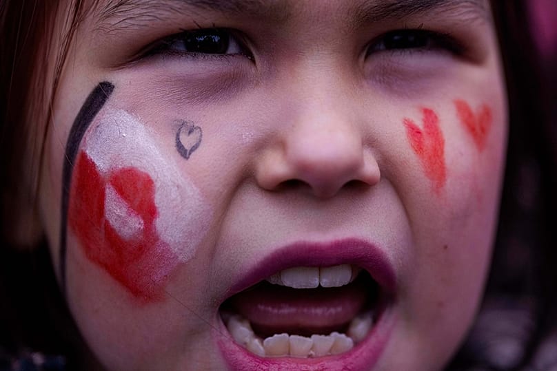 A girl shouts during protest against Trump's policy towards Greenland in front of the US consulate in Nuuk, Greenland, Saturday, Jan. 17, 2026