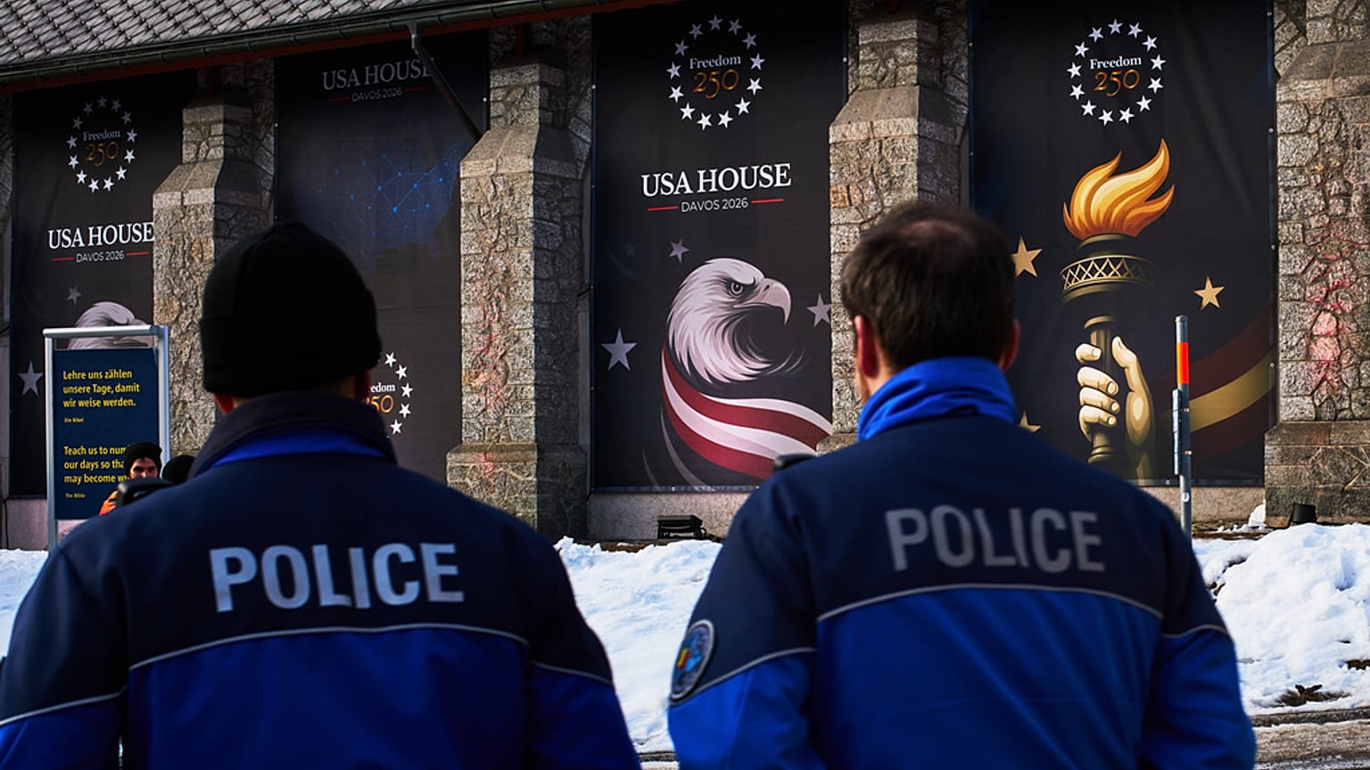 Police officers walk in front of the USA house ahead of the Annual Meeting of the World Economy Forum in Davos, 17 January 2026
