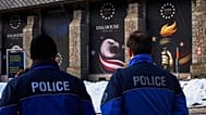 Police officers walk in front of the USA house ahead of the Annual Meeting of the World Economy Forum in Davos, 17 January 2026