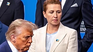 President Donald Trump, left, walks by Denmark's Prime Minister Mette Frederiksen prior to a group photo of NATO heads of state and government at the NATO summit in The Hague,