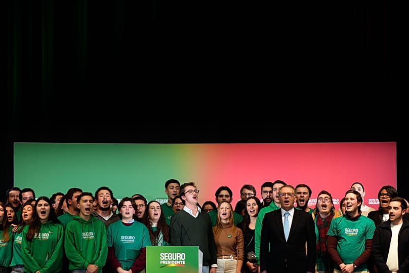 Presidential candidate Antonio Jose Seguro sings the national anthem on stage at the end of his campaign closing rally, in Lisbon, Friday, Jan. 16, 2026.