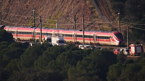 Emergency crews work alongside one of the trains involved in a train collision, in Adamuz, Spain, Monday, Jan. 19, 2026.