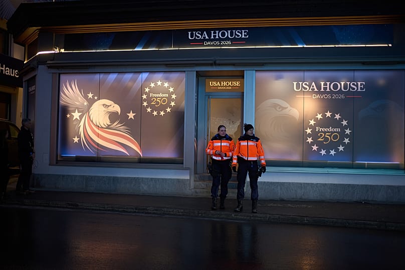 Police officers guard in front of a branch office of the USA House at the eve of the start of the Annual Meeting of the World Economy Forum in Davos, 18 January 2026