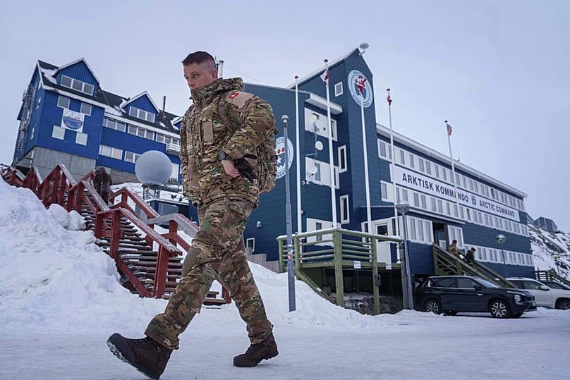 FILE: A Danish serviceman walks in front of Joint Arctic Command center in Nuuk, 16 January 2026