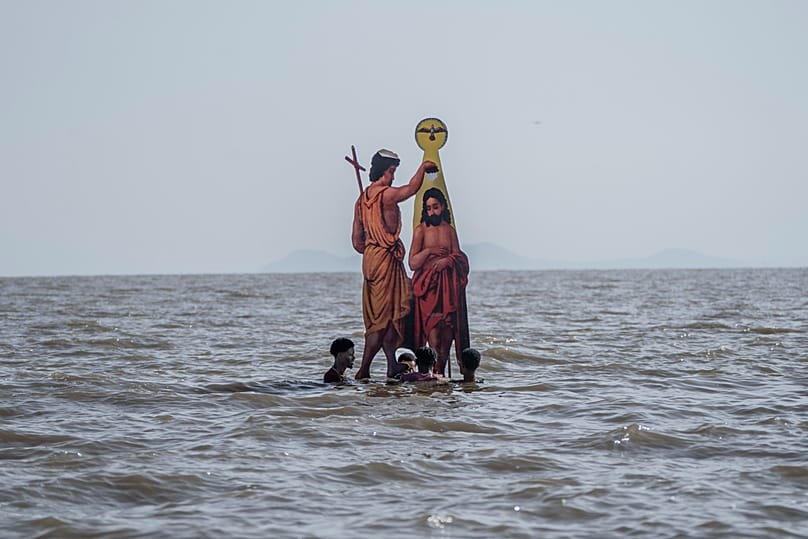 Ethiopian Orthodox devotees place an icon of John the Baptist baptizing Jesus, during the celebration of Epiphany on the shore of lake Dembel, in Batu, Ethiopia, Jan. 19, 2026