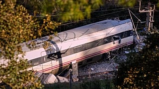 Part of a wrecked train is photographed at the site of a train collision in Adamuz, 19 January, 2026