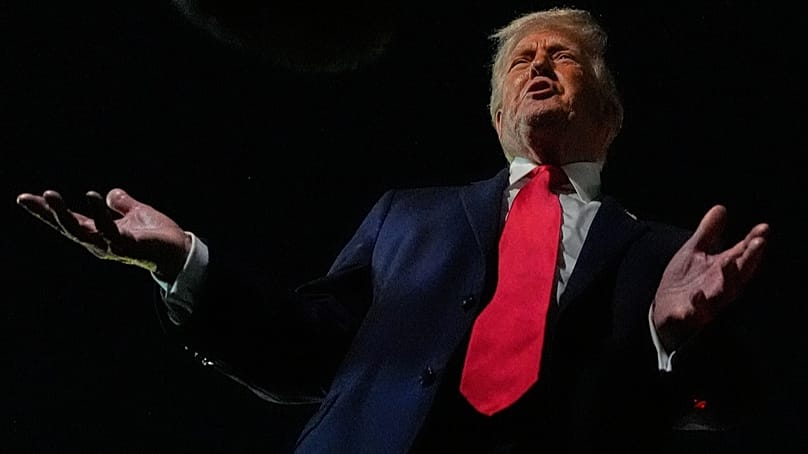 President Donald Trump speaks to reporters before boarding Air Force One at Palm Beach International Airport, Monday, Jan. 19, 2026, in West Palm Beach, Fla