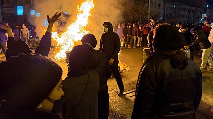 In this photo obtained by The Associated Press, Iranians attend an anti-government protest in Tehran, Iran, Friday, Jan. 9, 2026.