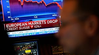 FILE. Traders work on the floor at the New York Stock Exchange. 15 March 2023.