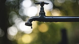 Close-up shot of a water tap.