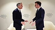 Canada Prime Minister Mark Carney meets with French President Emmanuel Macron as they attend the World Economic Forum in Davos, Switzerland on Tuesday, Jan. 20, 2026. 