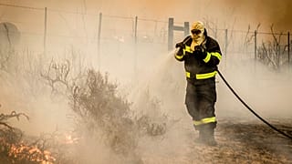 Fire crews battle to contain wildfires east of Cape Town 