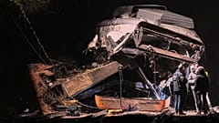 Emergency crews respond after a commuter train derailed when a retaining wall collapsed onto the tracks in Gelida, near Barcelona, Spain, Tuesday, Jan. 20, 2026.