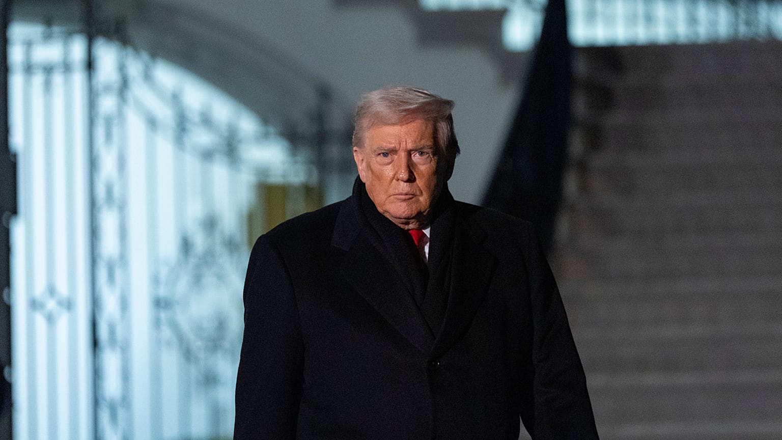 US President Donald Trump walks speak with reporters before departing on Marine One from the South Lawn of the White House, Tuesday, Jan. 20, 2026, in Washington. 