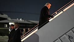 President Donald Trump boards Air Force One for a trip to attend the World Economic Form in Davos, Tuesday, Jan. 20, 2026, at Joint Base Andrews